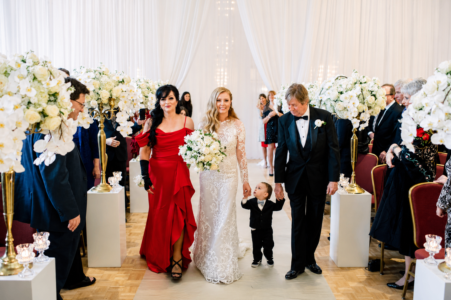 Dave escorting the bride down the aisle at a wedding