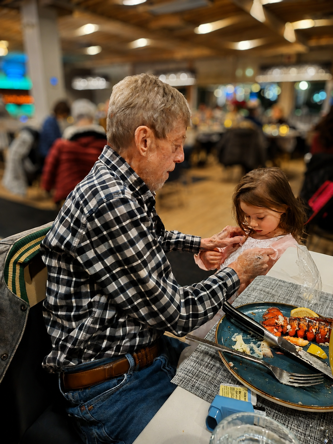 Dave sharing a quiet moment at dinner with his young granddaughter