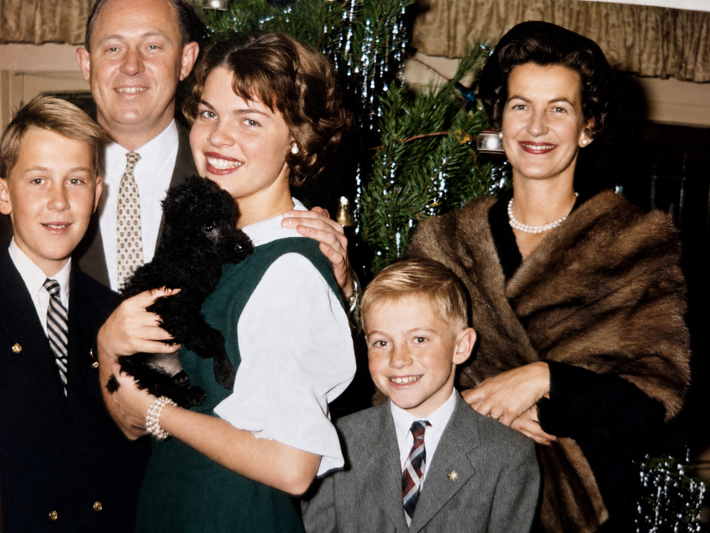 The Brooks family gathered around the Christmas tree in the 1950s